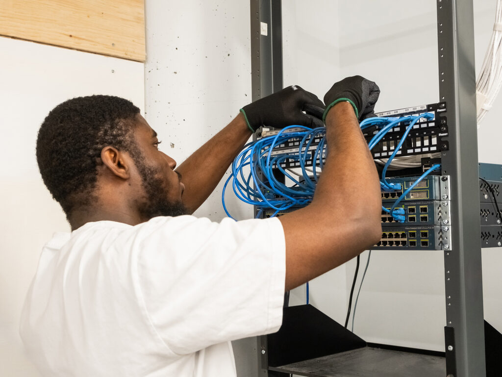 Student installing wiring