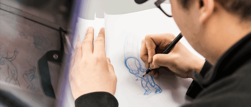 A student appears sketching an animation on paper.