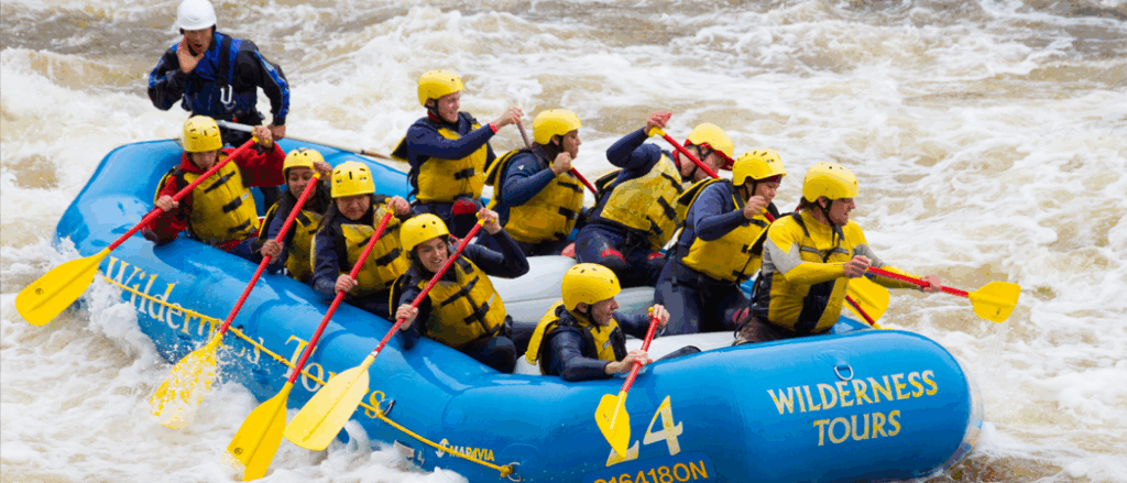 A group of students rafting down rapids in the Ottawa river.