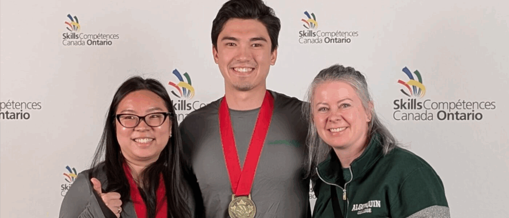 Two students pose for a photo wearing gold medals at the Skills Ontario Competition 2025.