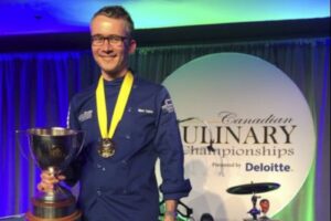 Marc Lépine holds a trophy and wears a gold medal at CCC 2016.