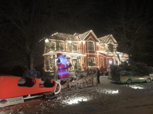 The exterior of a home with an elaborate Christmas display depicting scenes and characters from National Lampoon's Christmas Vacation (1989).
