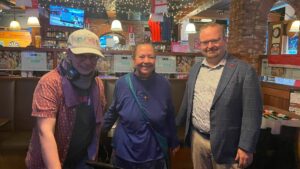 Three people stand for a picture: Holl Ellingwood, Nancy Arthur Best, and MPP Stephen Blais.