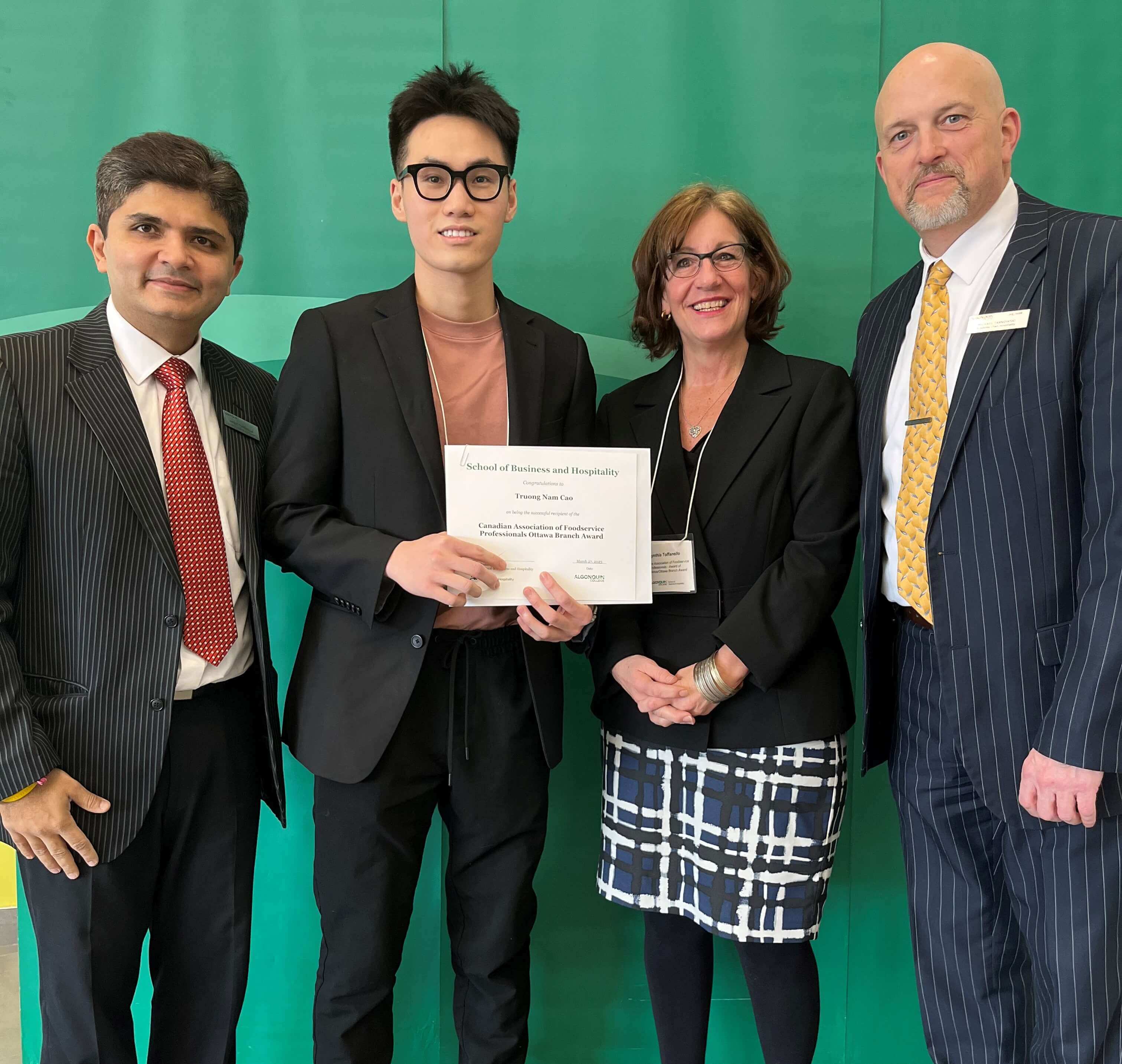 Student Truong Nam Cao, Recipient of the Canadian Association of Foodservice Professionals Ottawa Branch Award, with professors