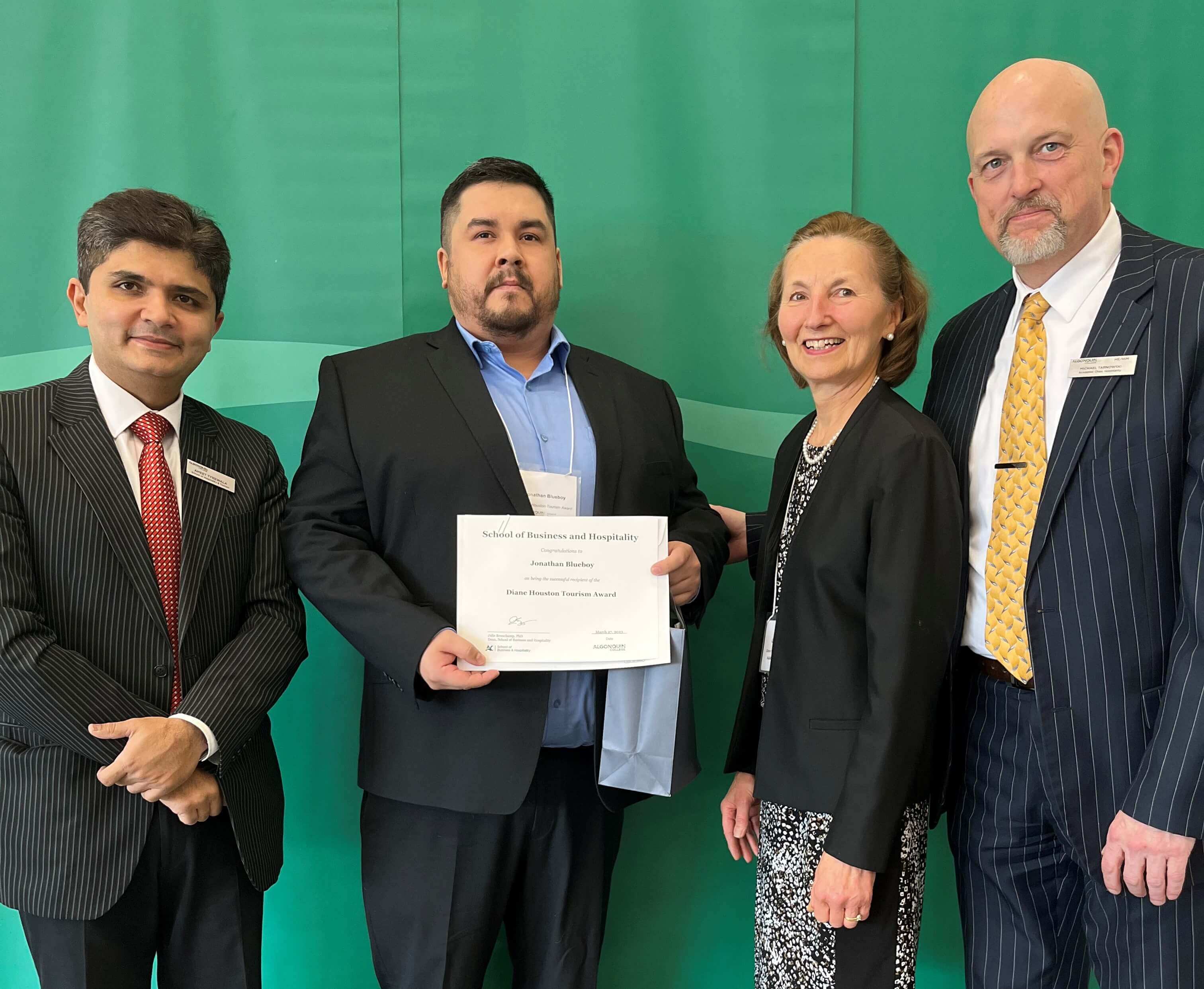 Student Jonathan Blueboy, Recipient of the Diane Houston Award, with professors