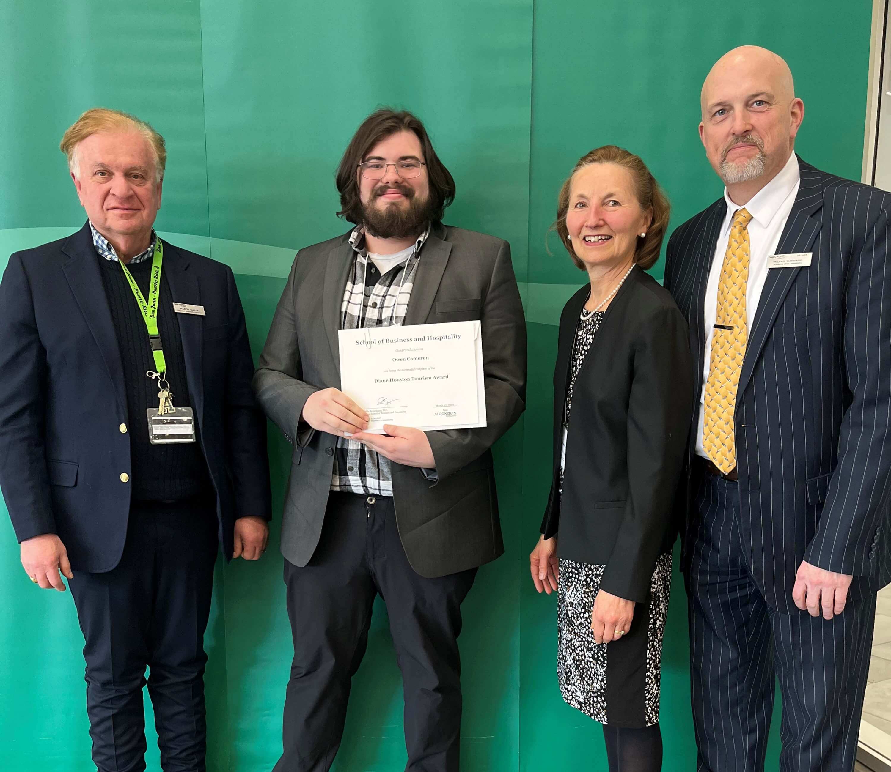 Student Owen Cameron, Recipient of the Diane Houston Award in Tourism-Travel Services, with professors