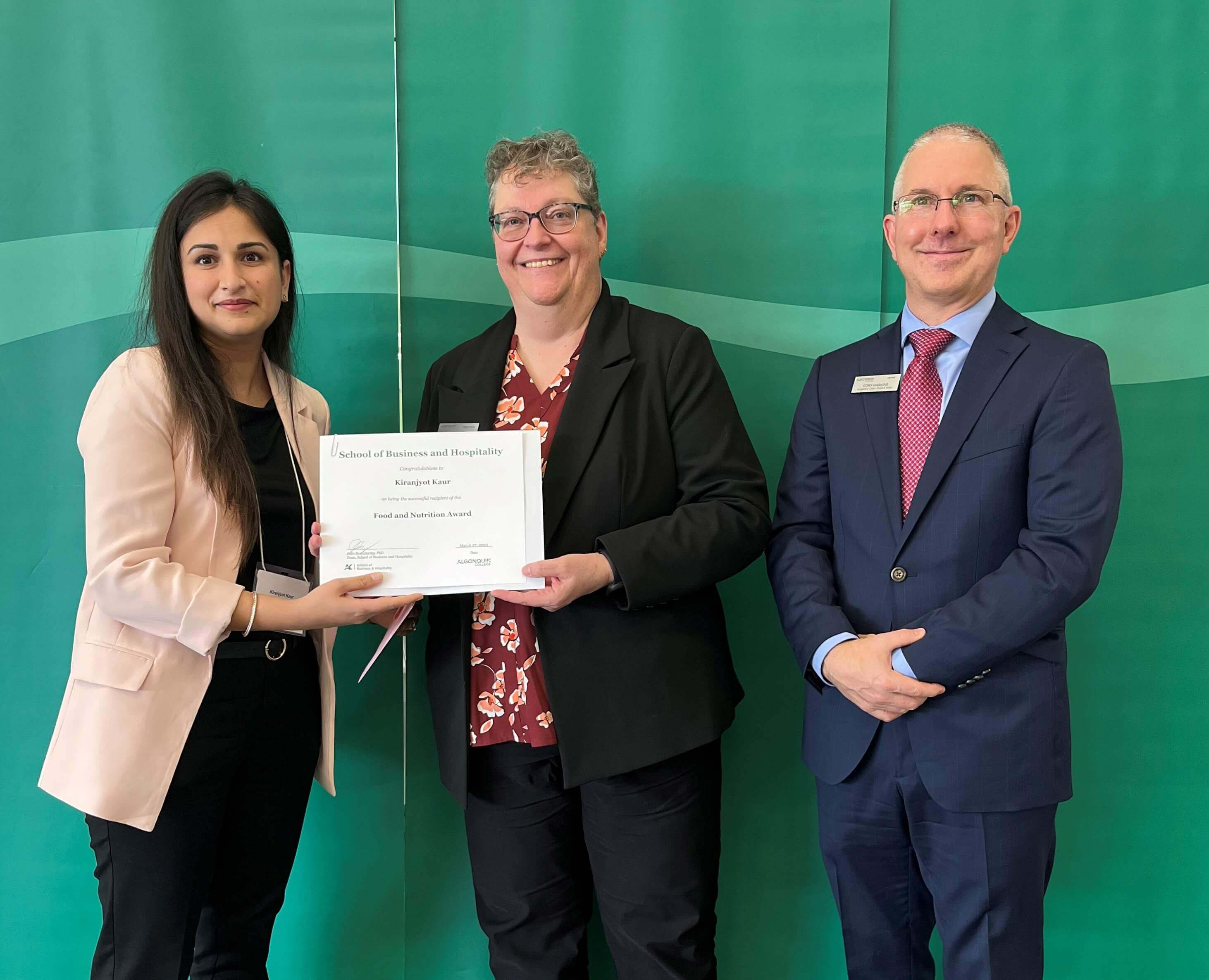 Student Kiranjyot Kaur, Recipient of the Food and Nutrition Award, with professors