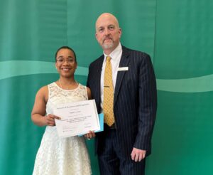 Angela Ventura posing with their award