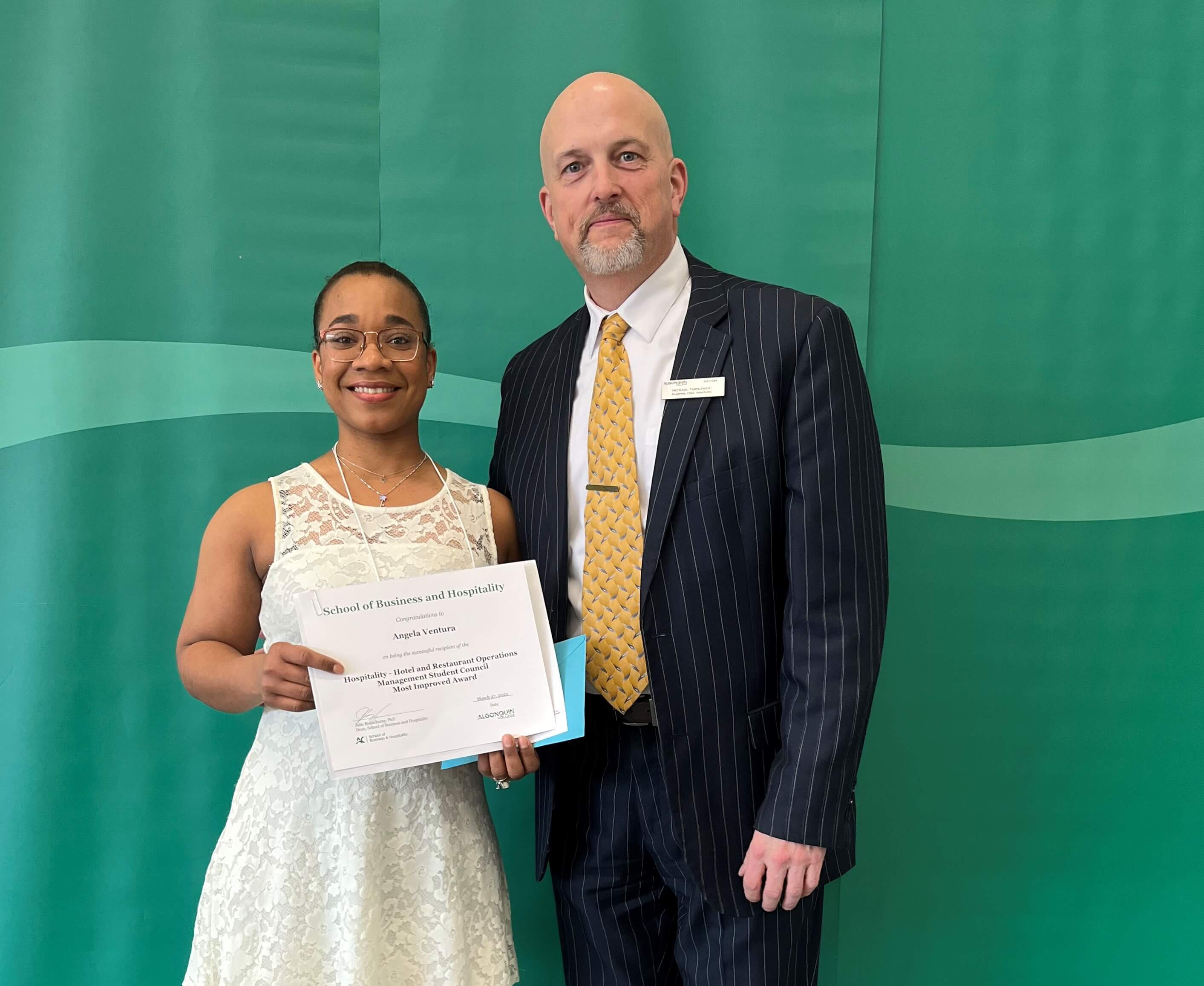 Student Angela Ventura, Recipient of the Hospitality - Hotel & Restaurant Operations Management Student Council - Most Improved Award, from professors