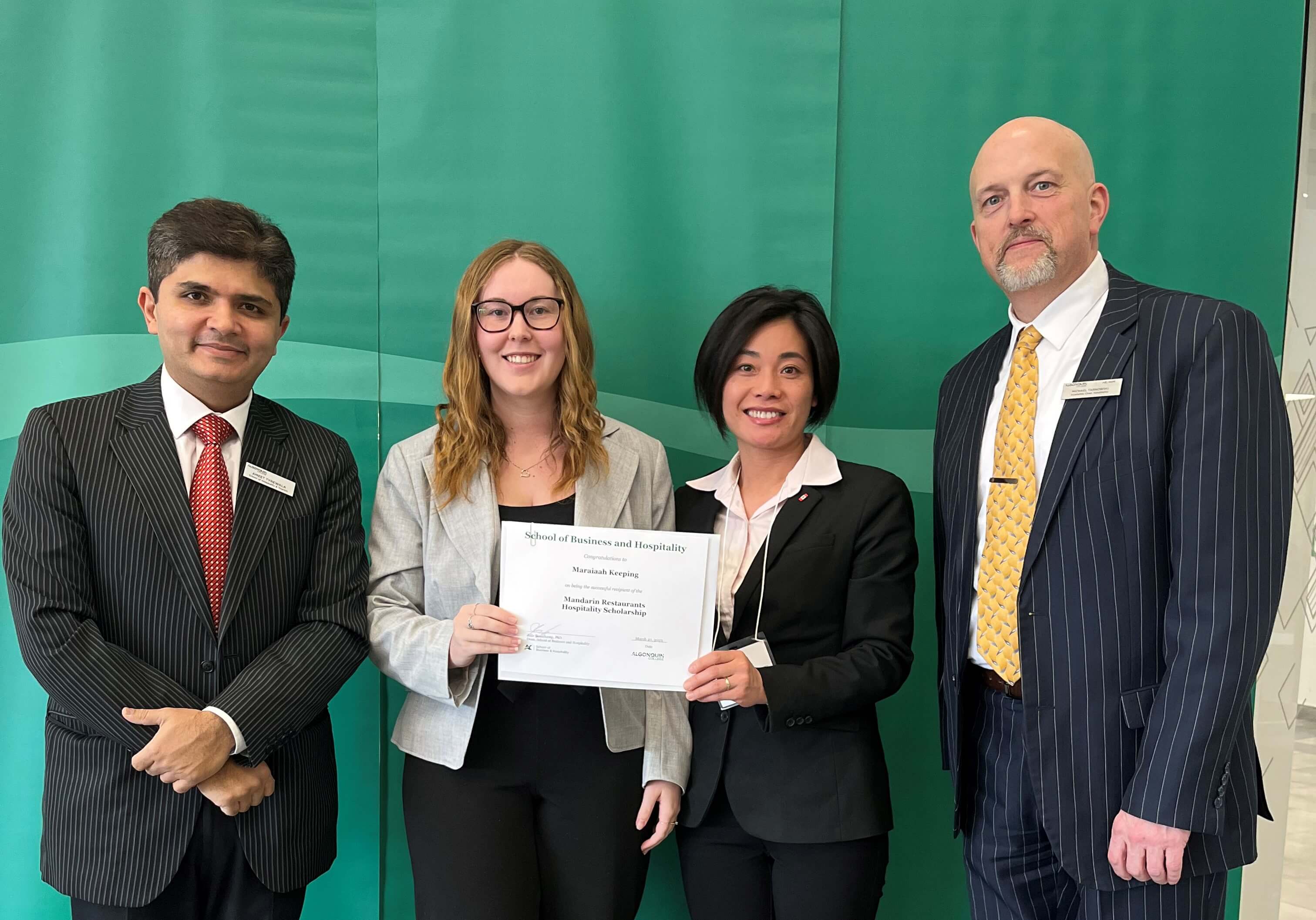 Student Maraiaah Keeping, Recipient of the Mandarin Restaurant Hospitality Scholarship, with professors