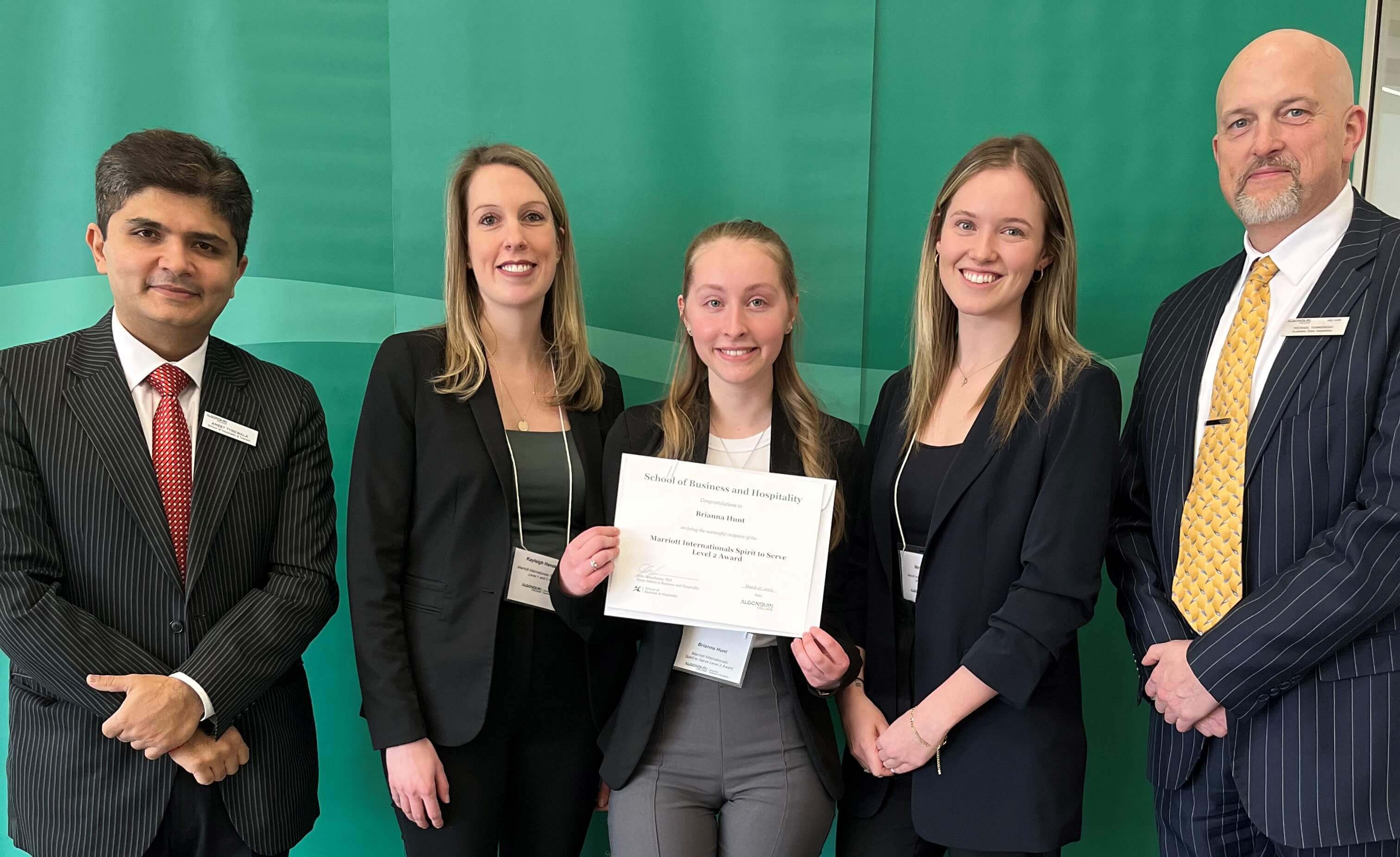 Student Brianna Hunt, Recipient of the Marriott International Spirt to Serve Level 2 Award, with professors