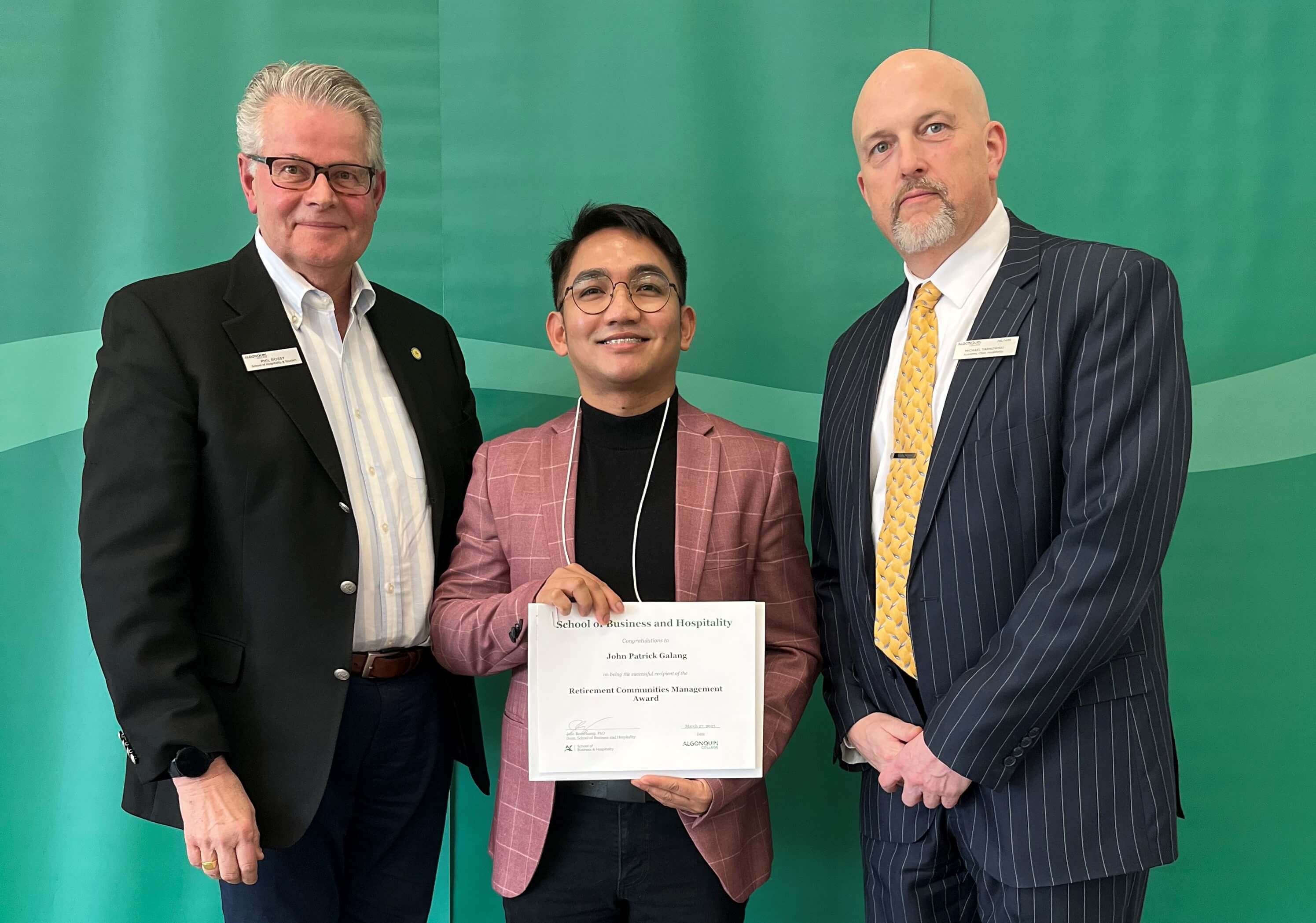 Student John Patrick Galang, Recipient of the Retirement Communities Management Award, with professors