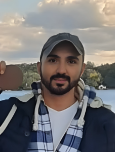 Smiling male graduate outdoors