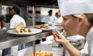 Culinary Skills student in culinary lab with plated food
