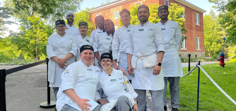 Culinary learners prepping food at PM Garden Party