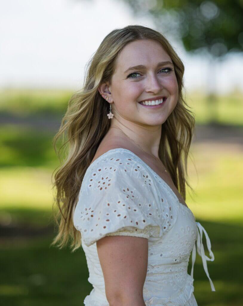 female Business Agriculture student outside, smiling