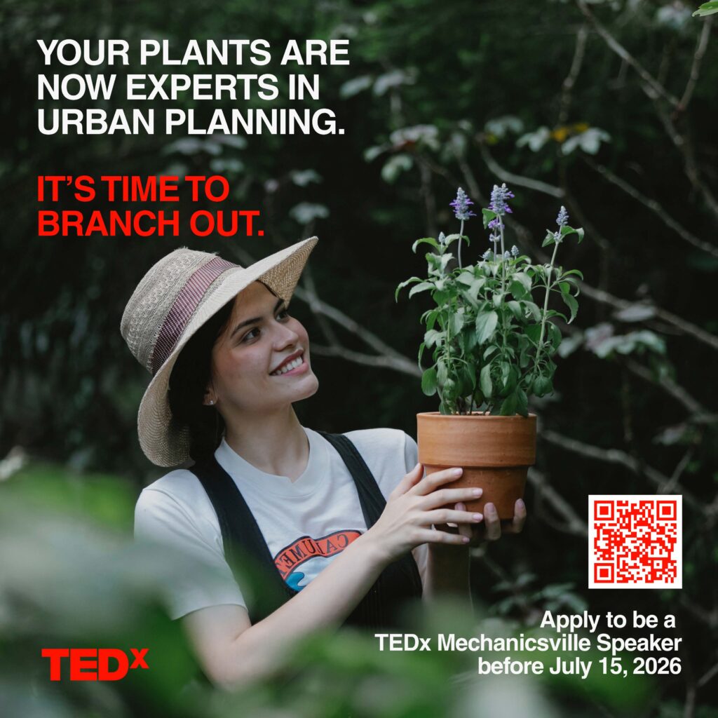 female gardener outside holding plants