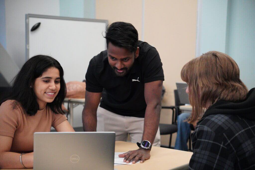 Students working at laptop