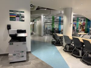 An image of a Ricoh multi function printer located on the second floor of C building, located in the DARE district near the elevator