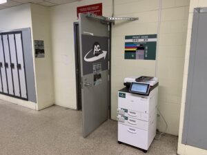 An image of a Ricoh multi function printer located on the first floor of A building.