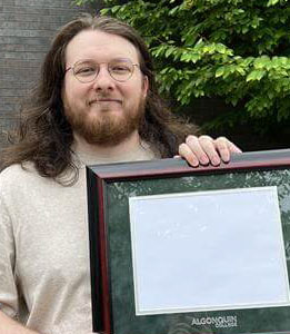 Photo of Esten with prize.