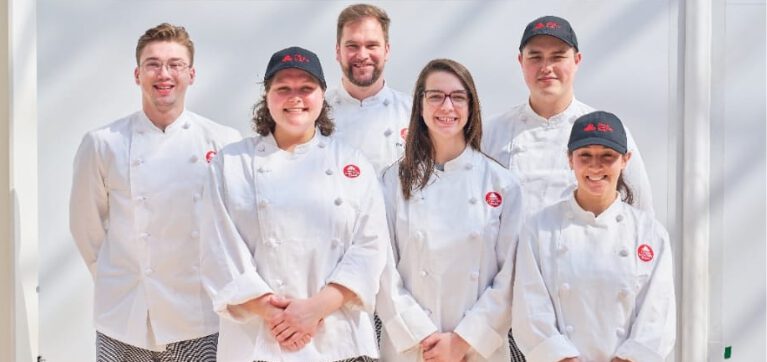 Chef Cameron (back centre) pictured with his student group.