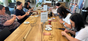 Students create medicine pouches at an SA event