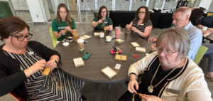 AC employees create medicine pouches.