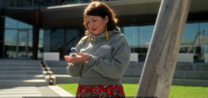 Director of Indigenous Initiatives Anita Tenasco holding a blue jay in Ishkodewan