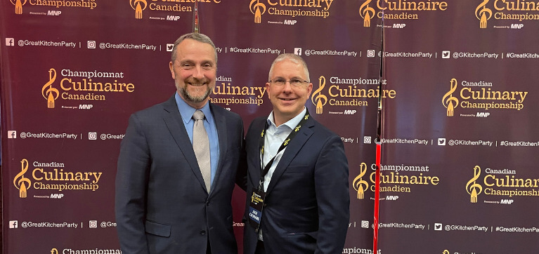 Cory Haskins (right), Dean, School of Business and Hospitality and Canadian Culinary Championship judge, pictured with Grant Perry (left), Vice President, Finance and Administration, in attendance supporting learners. 