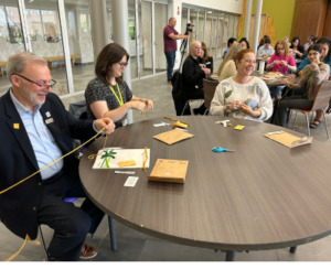 Claude Brule and Laine Johnson create their medicine shields