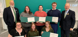 group of students holding awards