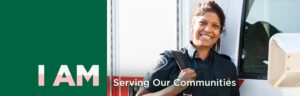 Paramedic student smiling, while leaning against a Paramedic Van