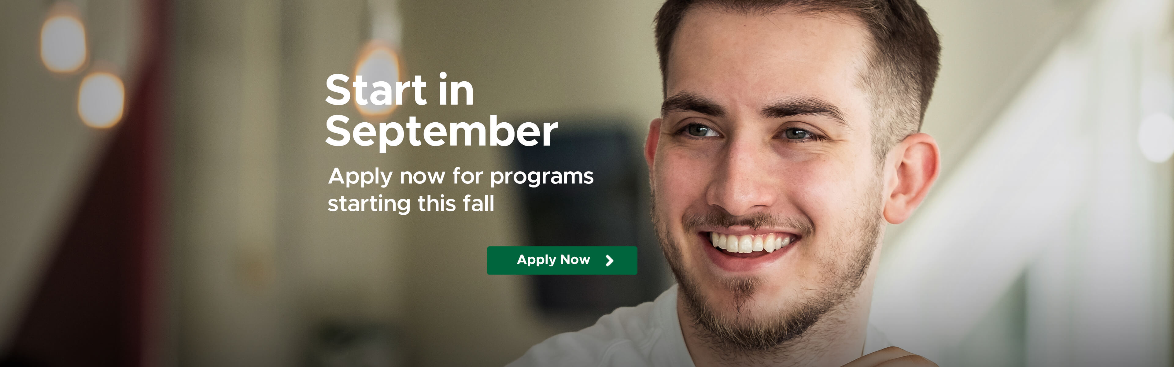 Male student smiling at camera.