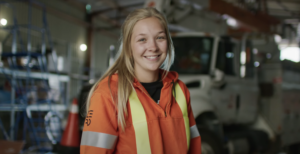 blonde woman in powerline gear smiling at camera