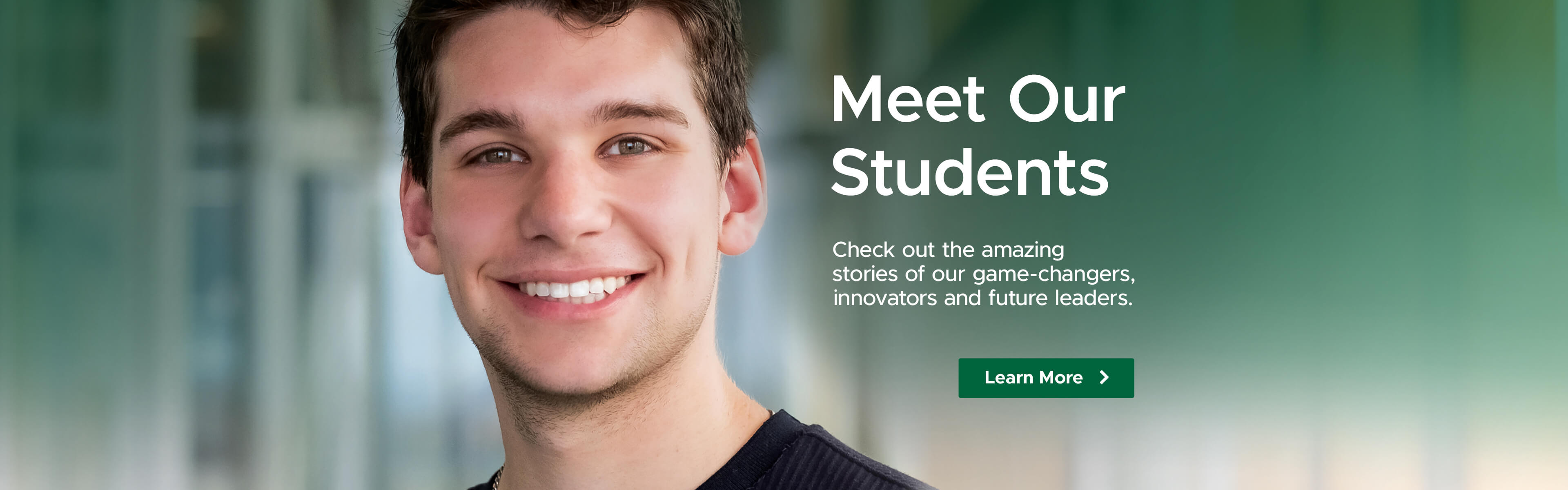 Male student smiling at camera