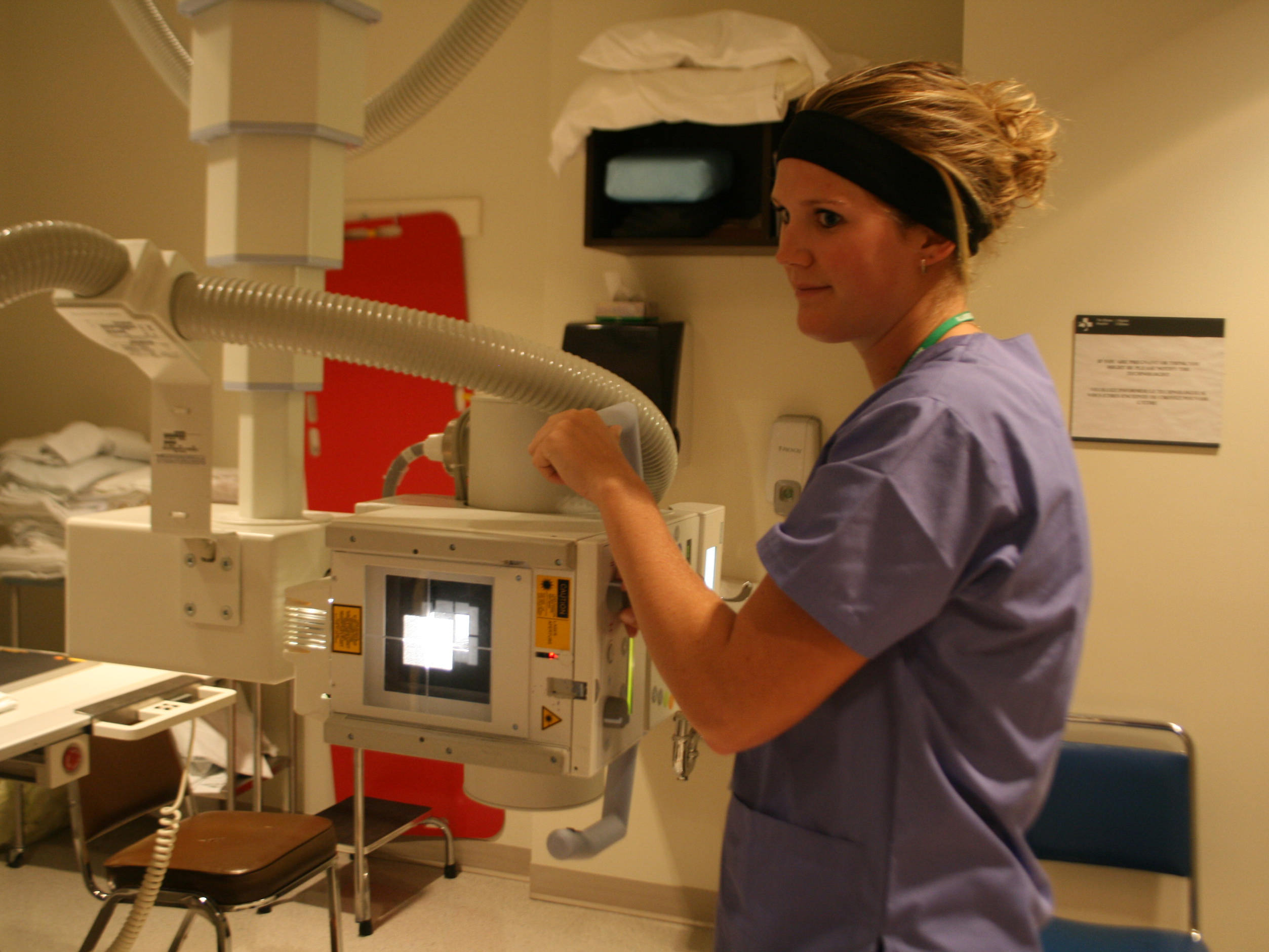 student demonstrating X-ray equipment