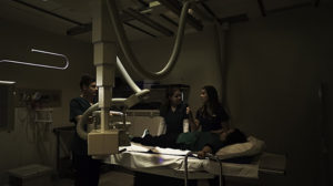 Alumni in the hospital setting working with an X-Ray machine