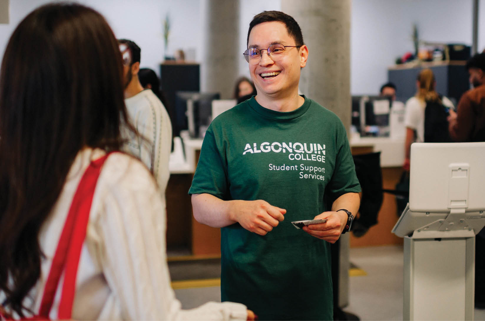 A man in a green shirt is smiling and holding a piece of paper. AI generated content