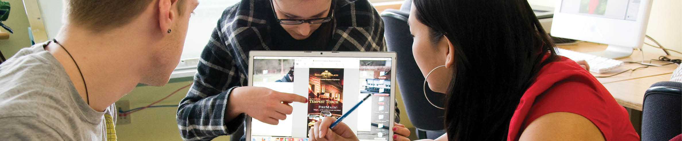 Three people are sitting around a table, looking at a laptop. One person is pointing at the screen, while the others are engaged in the discussion. There are chairs, a keyboard, a mouse, and a cell phone on the table. AI generated content