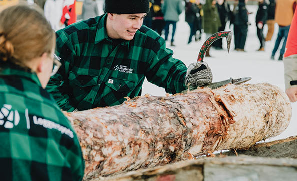 Two people are standing next to a large wooden log. AI generated content
