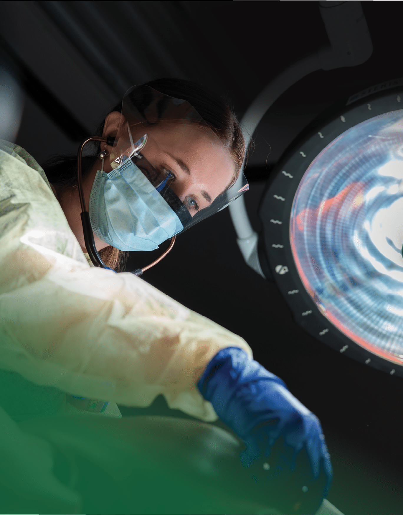 A person wearing a mask and gloves is working on a machine. Description generated by AI