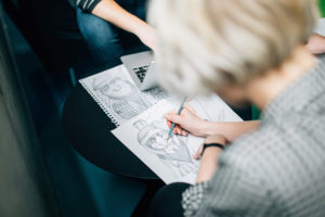 student sketching on paper