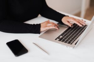Photo of someone typing on a laptop computer.