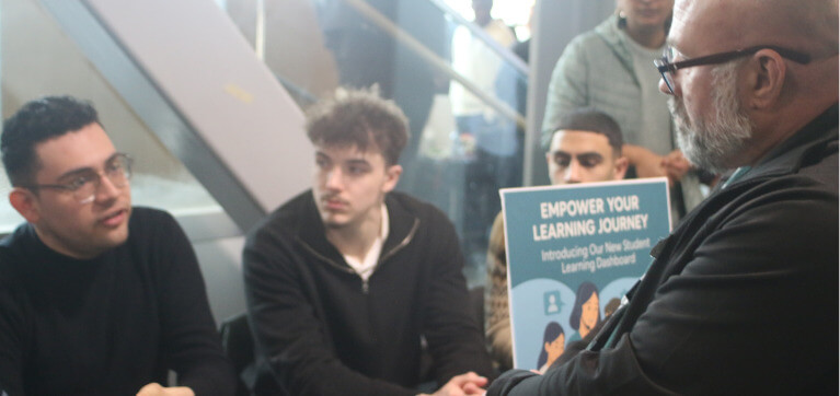 Students explain their project to an Algonquin College professor.