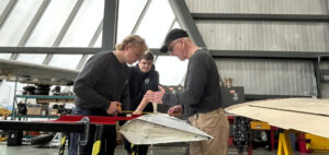 Aviation maintenance students with instructor