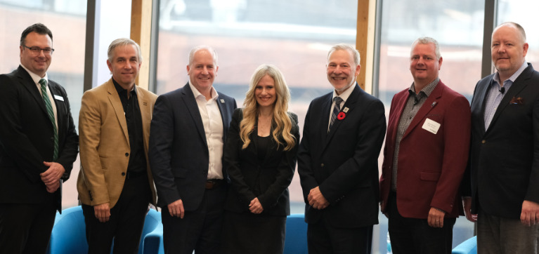 From left to right, Mark Savenkoff, Vice President, External Relations and Strategy, Algonquin College; Paul Knowles, Senior Vice President and District Manager, PCL Construction; Cameron Love, Cameron Love, President and CEO, The Ottawa Hospital; Sonya Shorey, President and CEO of Invest Ottawa, Bayview Yards and Area X.O.; Claude Brulé, President and CEO, Algonquin College;  Brad Warren, Vice President, Maintenance and Engineering, Porter Airlines; Jeffrey Maddox, President, Nokia Canada.