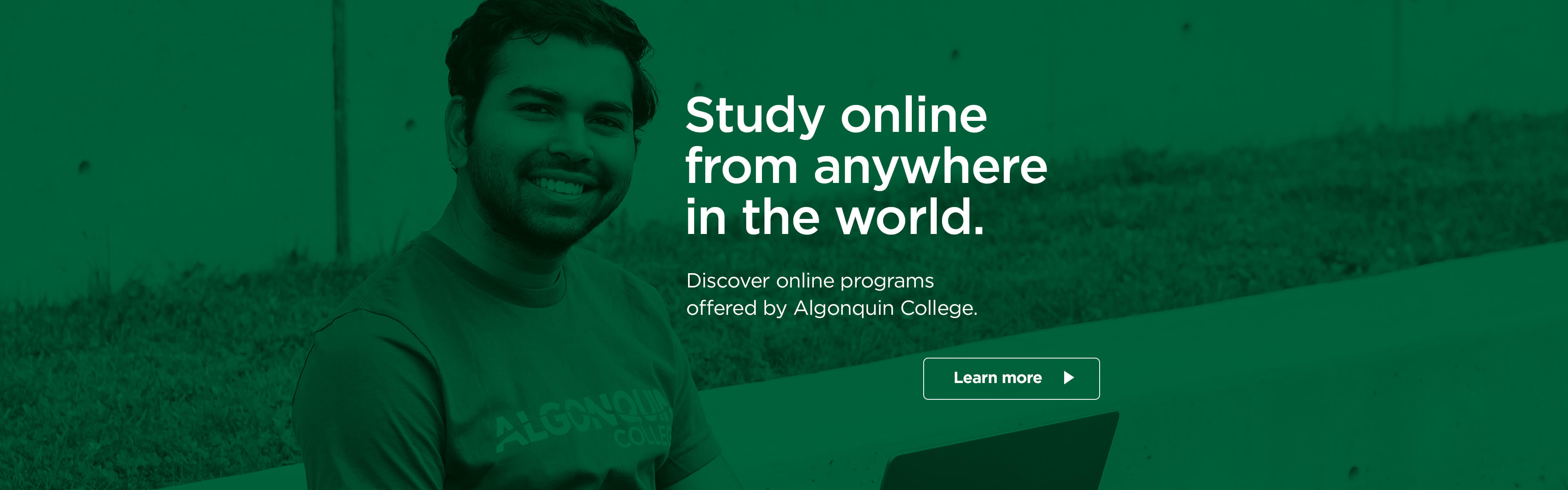 Male student sitting with a computer