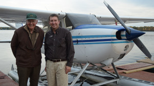 Del O'Brien standing in front of his airplane with Jamie Bramburger on a fall day