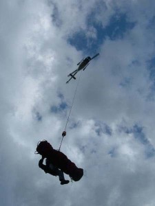 Martin Sprigg descending from a helicopter